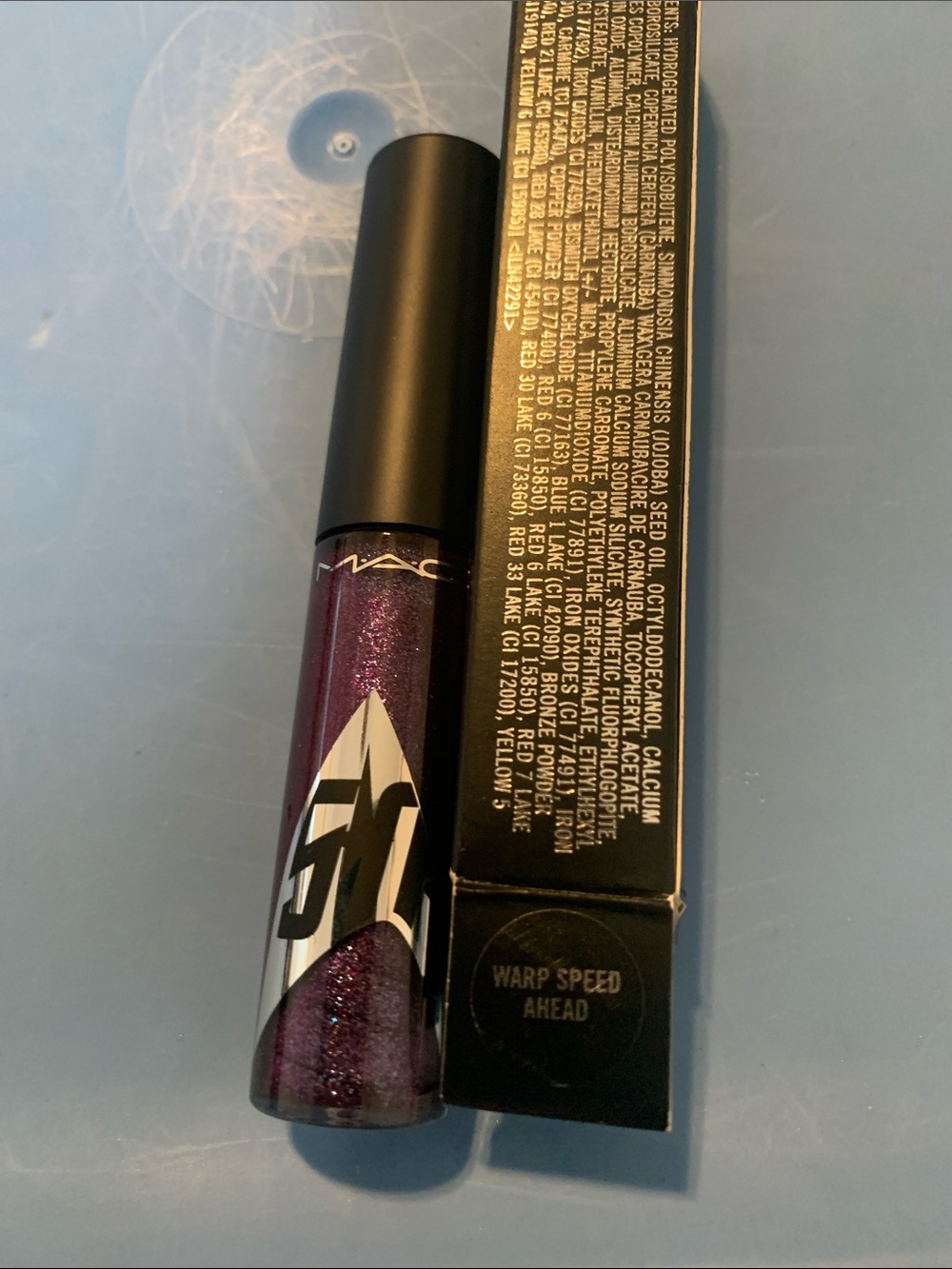 MAC Cosmetics Lipglass Gloss in Deep Sparkling Purple (Warp Speed Ahead)